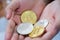 Gold and silver Bitcoins holding in hand, virtual manry and cryptocurrency concept