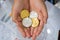 Gold and silver Bitcoins holding in hand, virtual manry and cryptocurrency concept