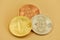 Gold silver bronze coins with bitcoin symbol