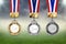 Gold, silver and bronze medals with ribbons