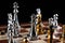 Gold and silver chess figures placed on chessboard