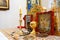 Gold and silver communion bowls  candles  icons and the Holy Gospel on the throne of the Orthodox Church