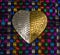 Gold and Silver Heart against a Colorful Metallic Weaving