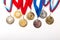 Gold and silver medals with ribbon on white background