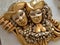 Gold and silver venetian festival mask. A souvenir mask depicts the face of a person, a harlequin of a theater satyr, jester or