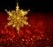 Gold Snowflake on Red Blur Background