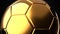 Gold soccer ball on black background.