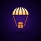 Gold Space capsule returning to earth via parachute icon isolated on black background. Vector Illustration