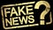 gold stamp with text Fake News