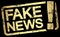 gold stamp with text Fake News