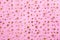 Gold stars on pink textile