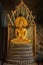 Gold statue of Buddha in Meditation with Naga Snake in Buddhist cave temple Wat Tham Suwankhuha Monkey Cave in Phang Nga Thailand
