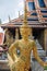 Gold statue of Kinnari, mythical creature half human half bird, at Temple of Emerald Buddha