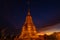 Gold stupa at Wat Tham Khaophoon in the sunrise. Kanchanaburi province-Thailand