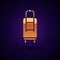 Gold Suitcase for travel icon isolated on black background. Traveling baggage sign. Travel luggage icon. Vector