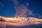 Gold sunset and summit of Lenin peak