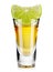 Gold tequila shot with lime isolated on white