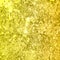 Gold texture with abstract yellow glitter.