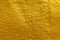 Gold texture background. Shiny rough gold texture surface