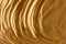 Gold texture. Wavy surface. Gold