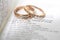 Gold Wedding rings on Bible verse, Love Never Ends