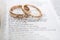 Gold Wedding rings on Bible verse, Love Never Fails