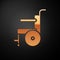 Gold Wheelchair for disabled person icon isolated on black background. Vector Illustration