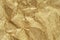 Gold wrinkled paper texture abstract background