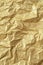 Gold wrinkled paper texture abstract background