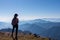 Goldeck - Active hiker woman looking at magical mountain peaks of Karawanks and Julian Alps seen from Goldeck, Latschur group