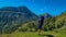 Goldeck - Man with baby carrier looking at majestic mountain peak Staff seen from Seetalnock, Goldeck, Latschur group