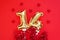 Golden 14 balloons  souvenir heart isolated on red background. Helium balloons  gold foil numbers.
