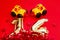 Golden 14 balloons  souvenir heart  and a toy taxi isolated on red. Helium balloons  gold foil numbers. Numbers for