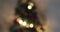 Golden abstract blinking blurred Christmas tree lights bokeh on gold warm background, festive holiday