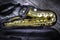 Golden alto saxophone in box