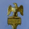 Golden ancient Roman sculpture of an eagle with the inscription H. et. P. lat: Heres ex testament posuit