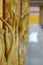 Golden angel hand statue holding lotus branch on temple wall