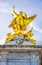 Golden angel sculpture on top of Victoria Memorial in front of Buckingham Palace, London, UK