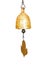 Golden antique bell on a string against white