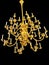 Golden antique chandelier isolated in black