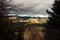 Golden autumn in the Carpathians. Mining arrays combined with trees with yellow leaves. Beautiful clouds and sun