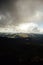 Golden autumn in the Carpathians. Mining arrays combined with trees with yellow leaves. Beautiful clouds and sun