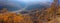 Golden autumn foliage of oaks, mountains and hills Panorama