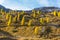 Golden autumn hills with larch trees on Falzarego Pass, Dolomites