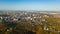 Golden autumn Kyiv cityscape, aerial drone view of city skyline and forest with yellow trees and beautiful landscape from above