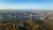 Golden autumn Kyiv cityscape, aerial drone view of city skyline and forest with yellow trees and beautiful landscape from above