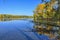 Golden autumn on lakeside - picturesque fall landscape near lake