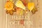 Golden autumn maple leaves on sunny day. Great season texture with fall mood. Nature october background with hand lettering Hello