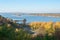 Golden autumn in Ukraine. View of the Dnieper, a small island and yellow trees in the city of Kanev, Ukraine