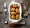 Golden baked potatoes with tomatoes, topview